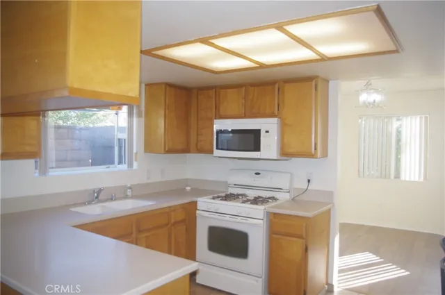 a kitchen with stainless steel appliances granite countertop a sink and cabinets