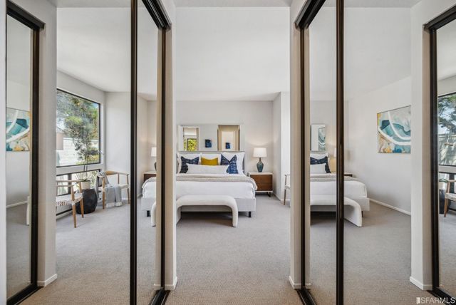a en suite bathroom with a tub shower and a couch