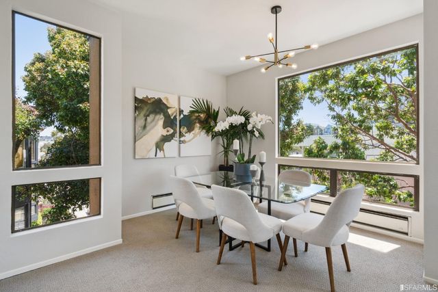 a view of a dining room with furniture window and outside view