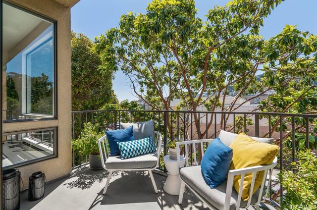 a view of balcony with furniture