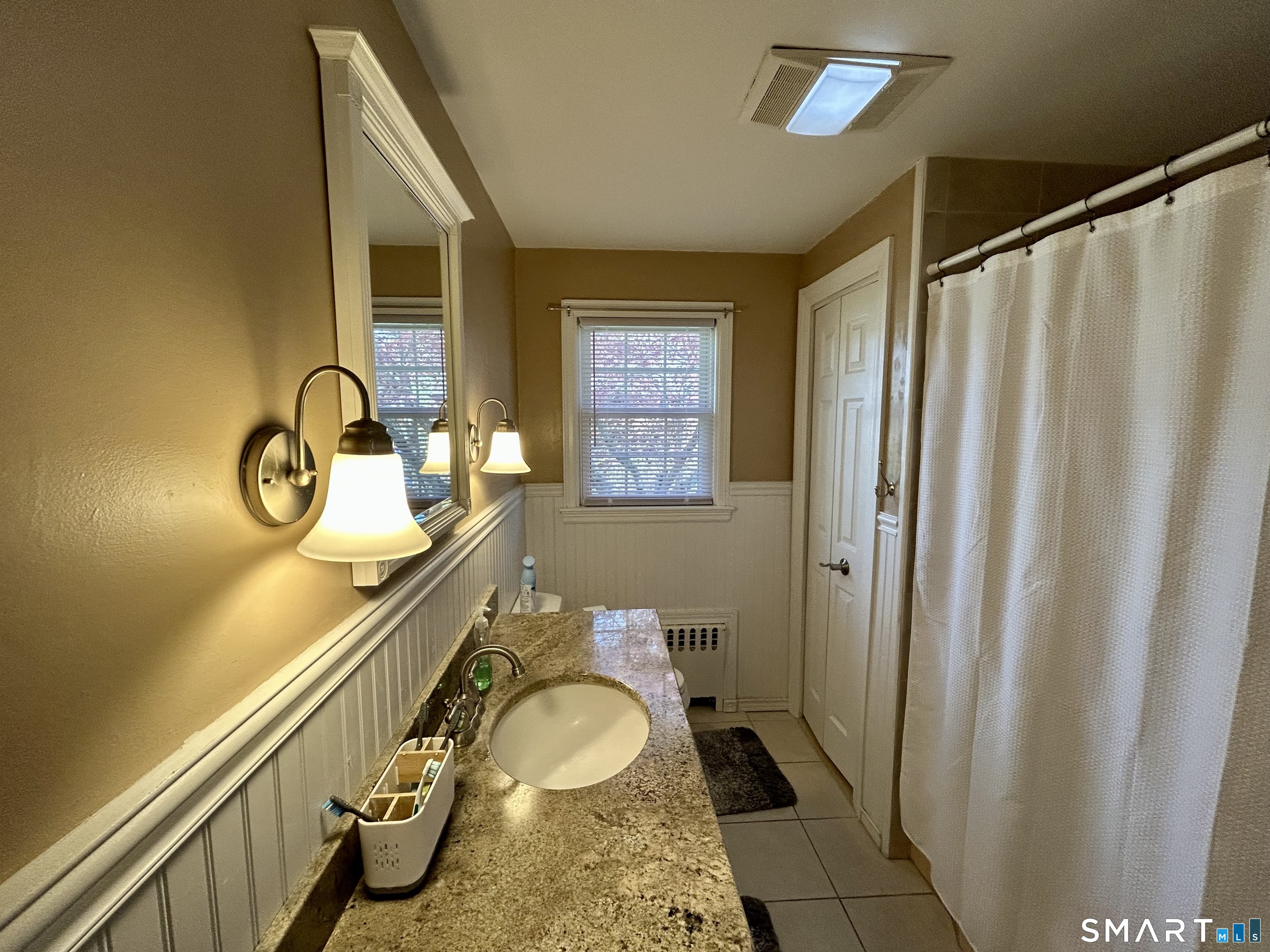 30 Apter Drive Torrington, CT 06790 - Photo 13 of 36 a bathroom with a granite countertop sink and a mirror