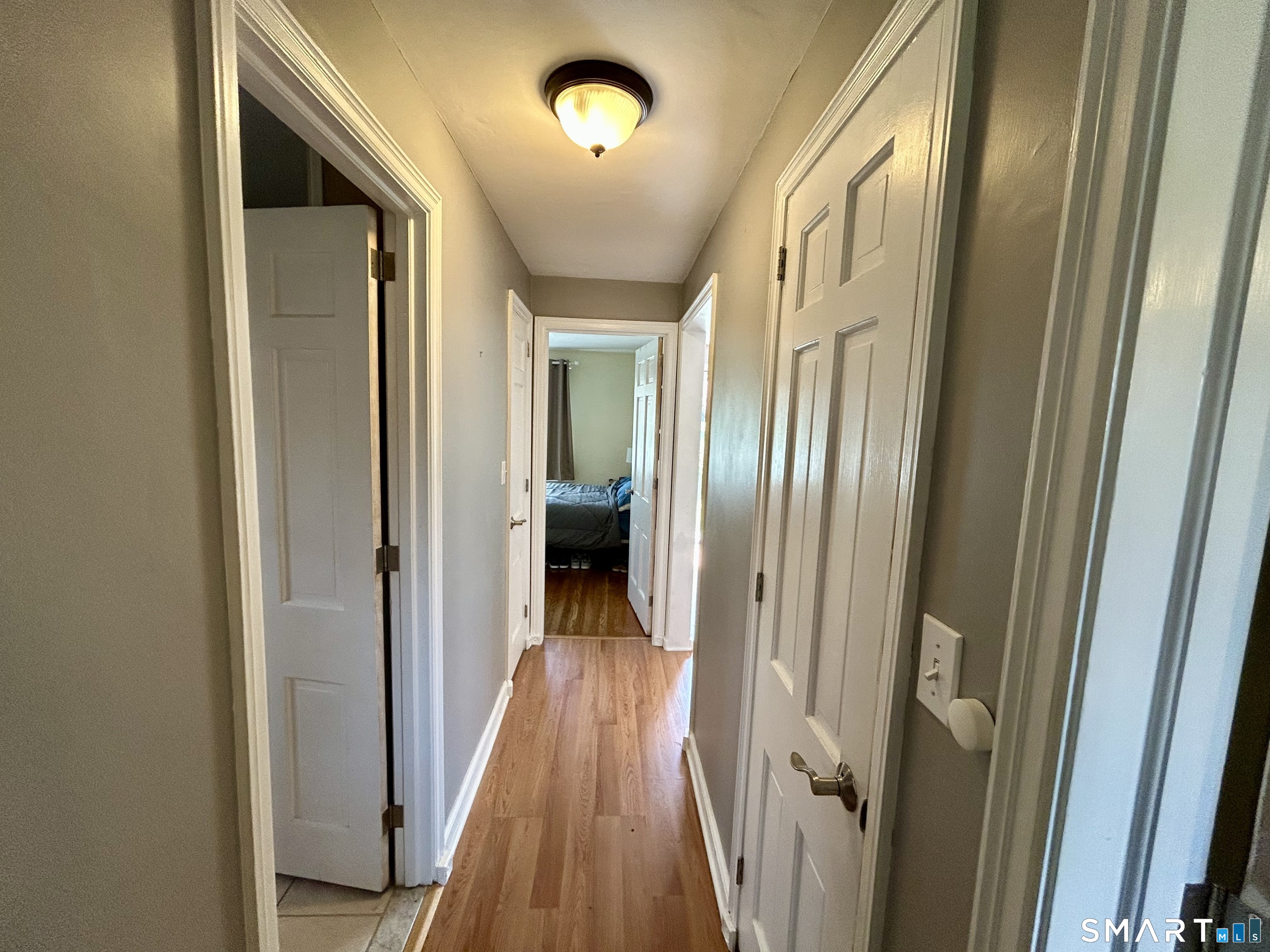 30 Apter Drive Torrington, CT 06790 - Photo 16 of 36 a view of a hallway with wooden floor and staircase