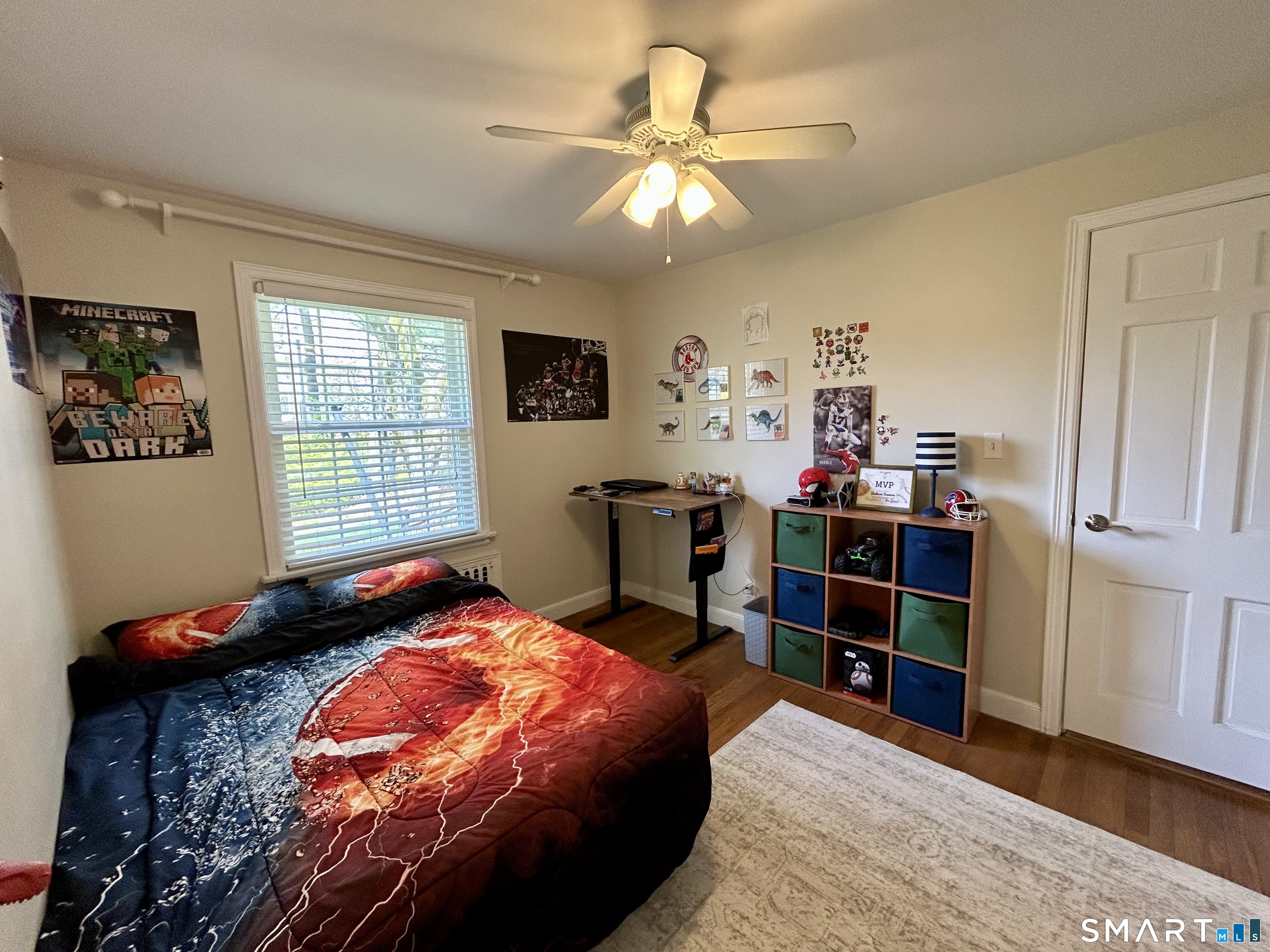 30 Apter Drive Torrington, CT 06790 - Photo 18 of 36 a bedroom with a bed and a chandelier