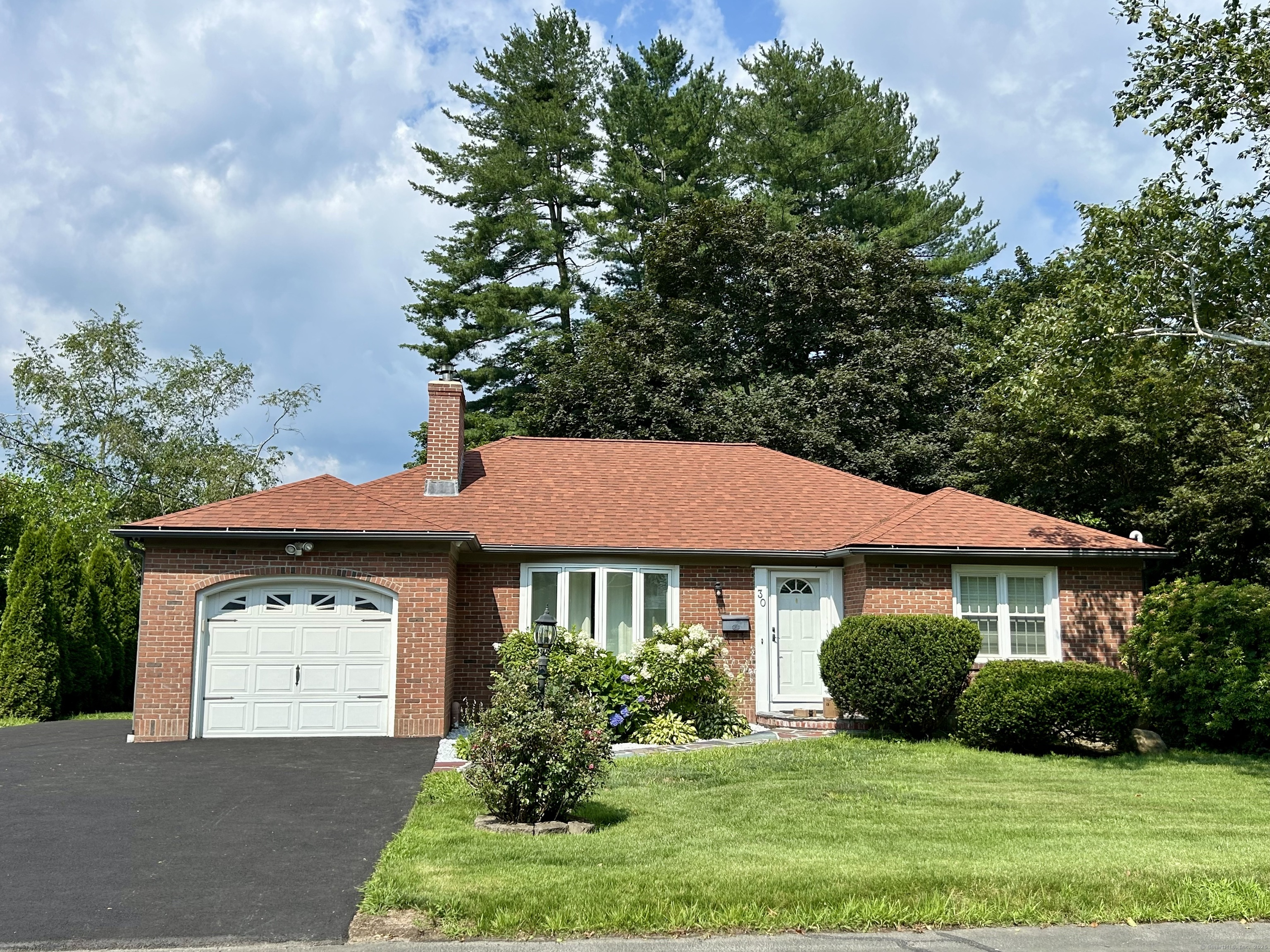 30 Apter Drive Torrington, CT 06790 - Photo 2 of 36 a front view of a house with a yard and garage