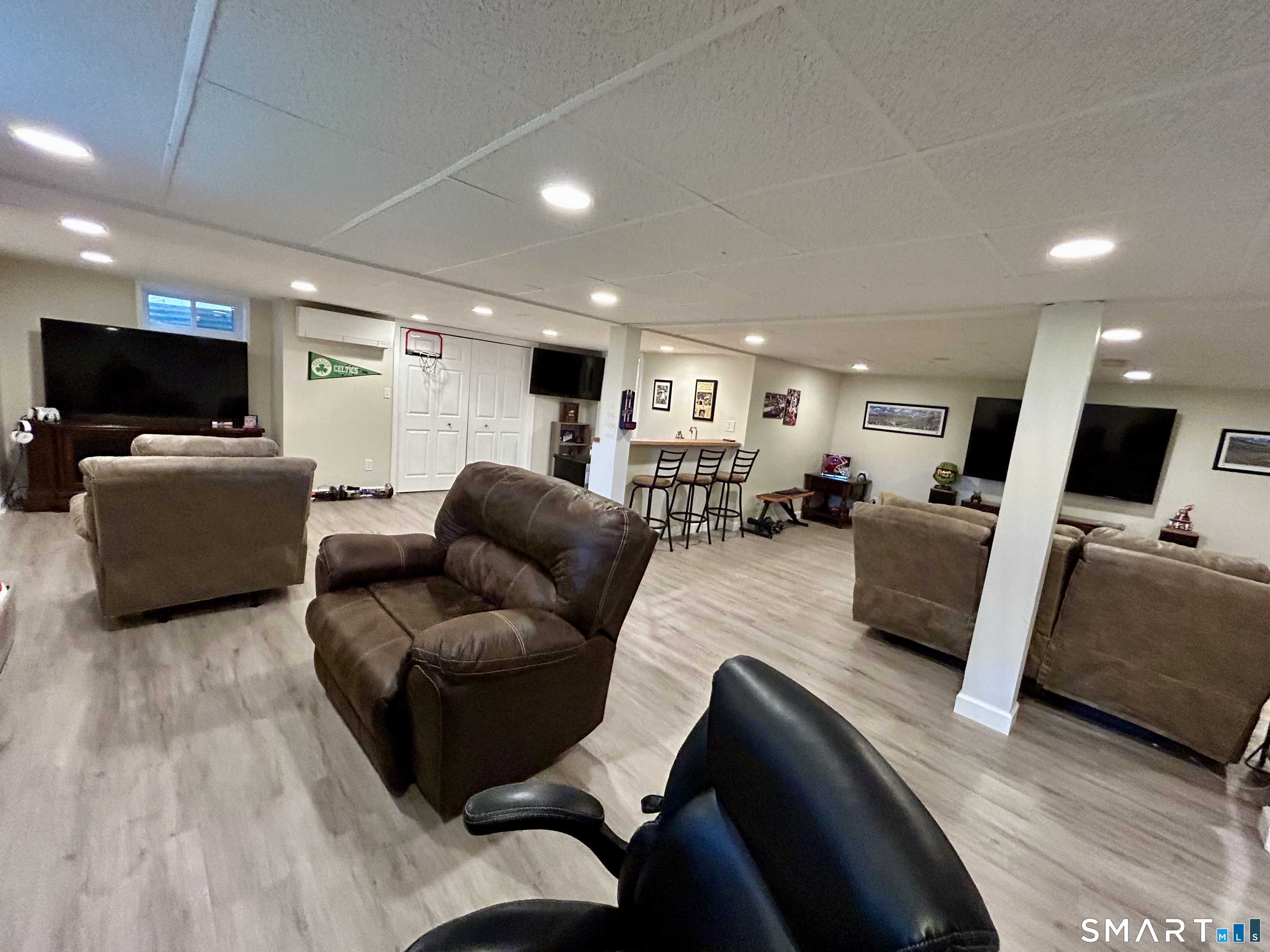 30 Apter Drive Torrington, CT 06790 - Photo 21 of 36 a living room with furniture and a flat screen tv