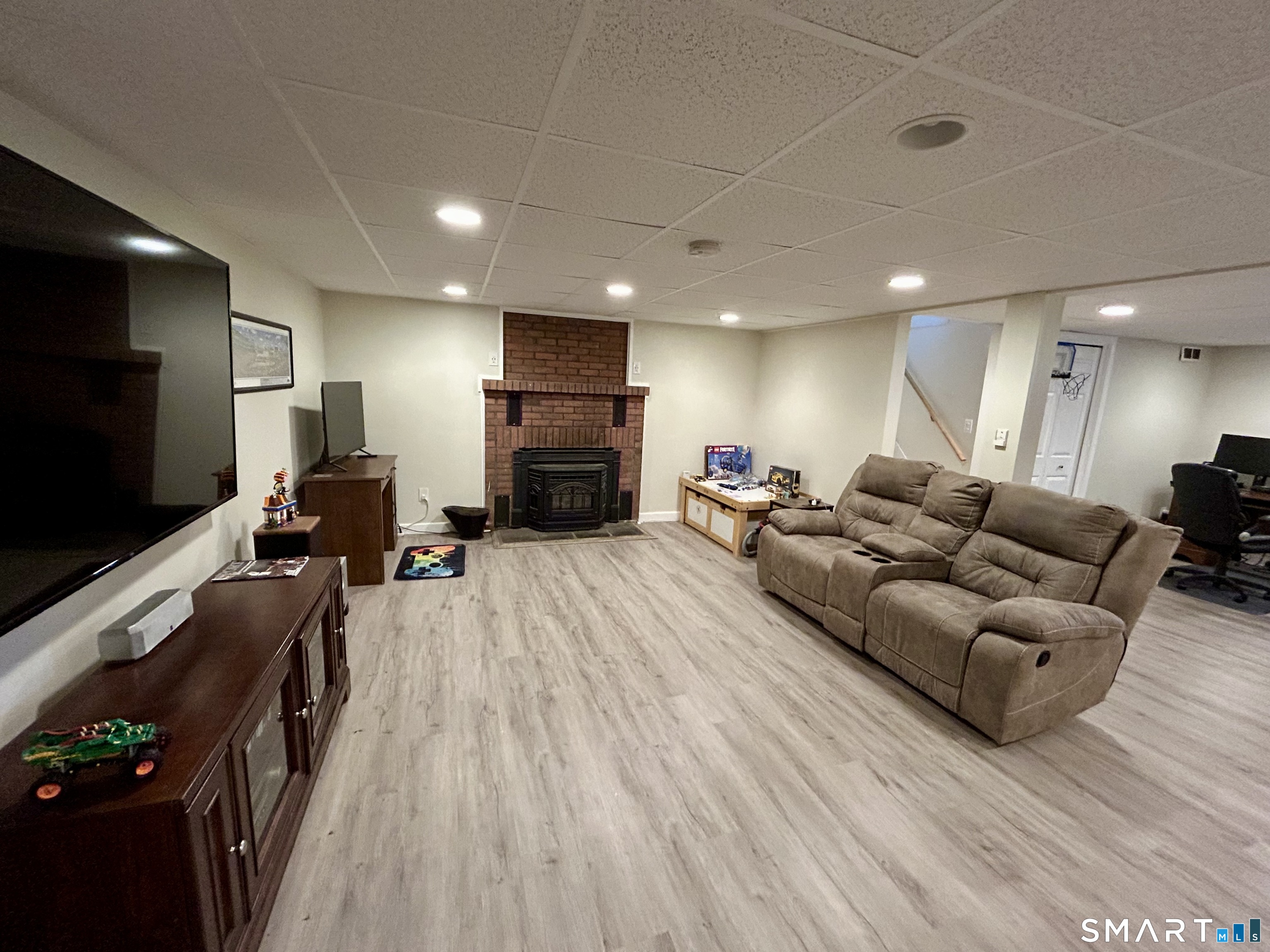 30 Apter Drive Torrington, CT 06790 - Photo 22 of 36 a living room with furniture and a flat screen tv