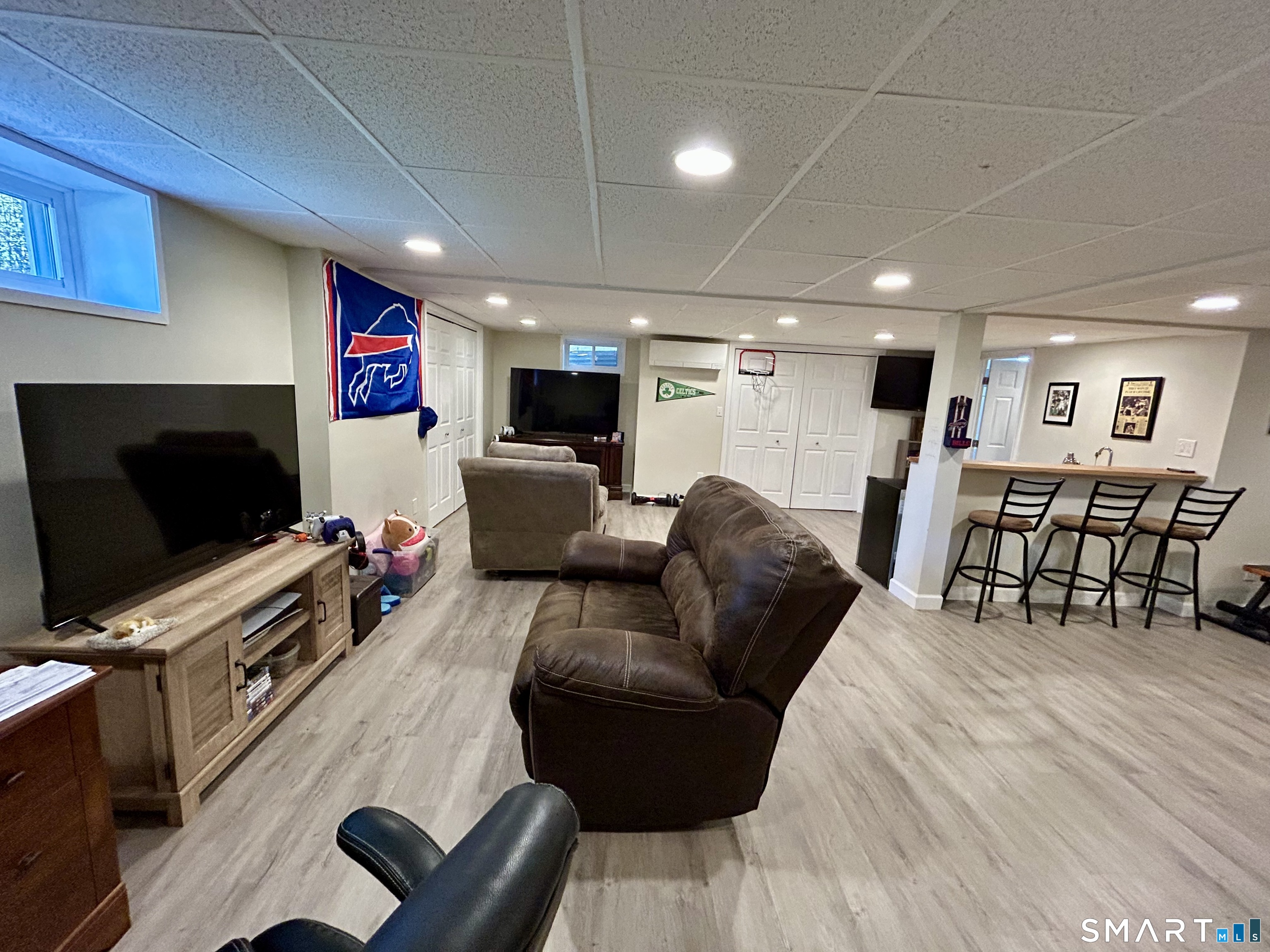 30 Apter Drive Torrington, CT 06790 - Photo 23 of 36 a living room with furniture and a flat screen tv