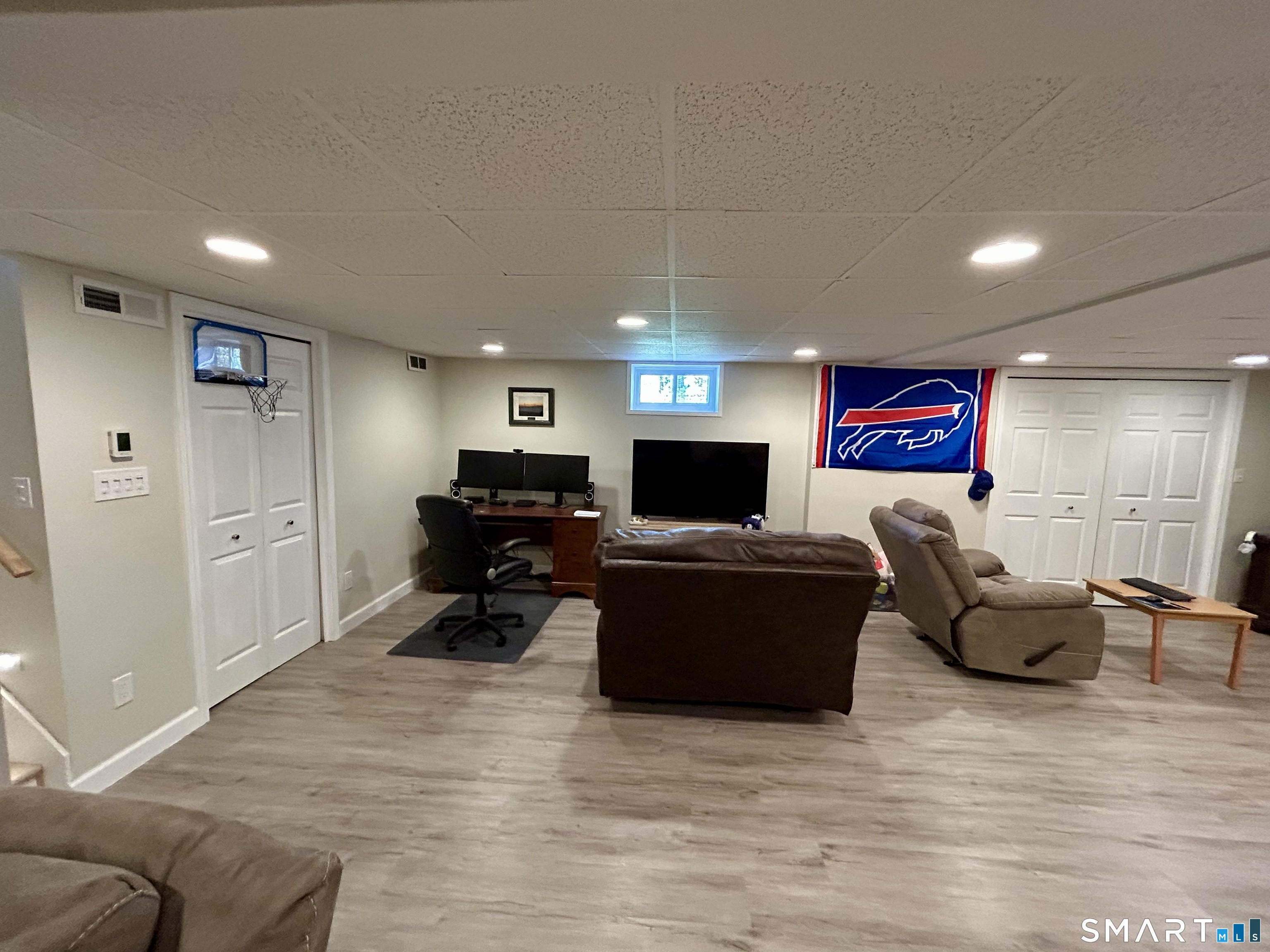 30 Apter Drive Torrington, CT 06790 - Photo 24 of 36 a living room with furniture and a flat screen tv