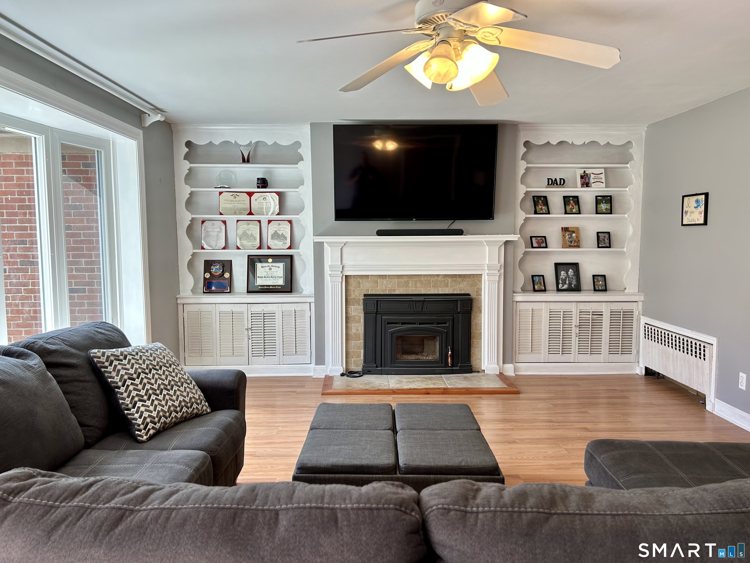 30 Apter Drive Torrington, CT 06790 - Photo 6 of 36 a living room with furniture a flat screen tv and a fireplace