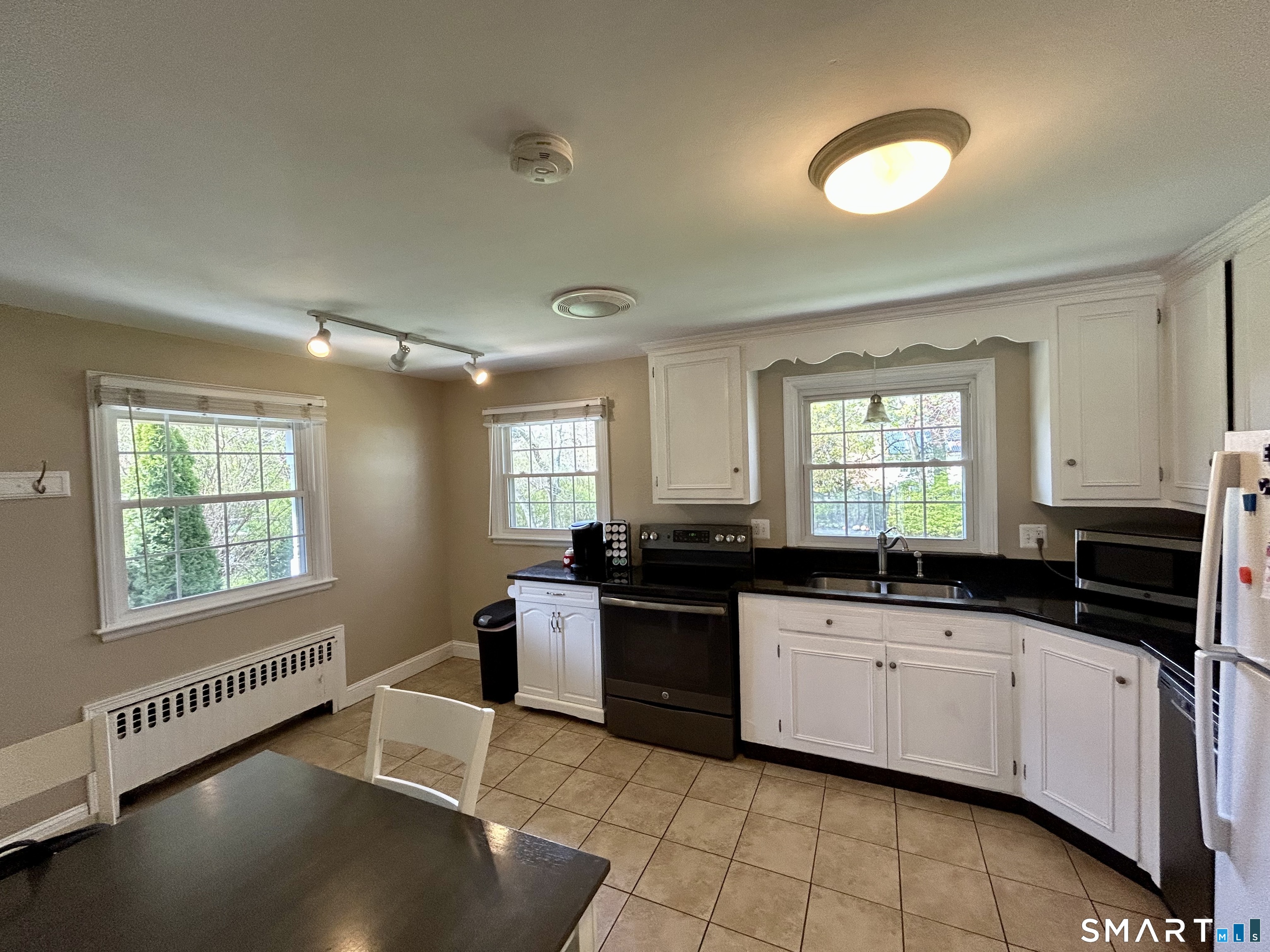 30 Apter Drive Torrington, CT 06790 - Photo 7 of 36 a kitchen with a sink a window and cabinets