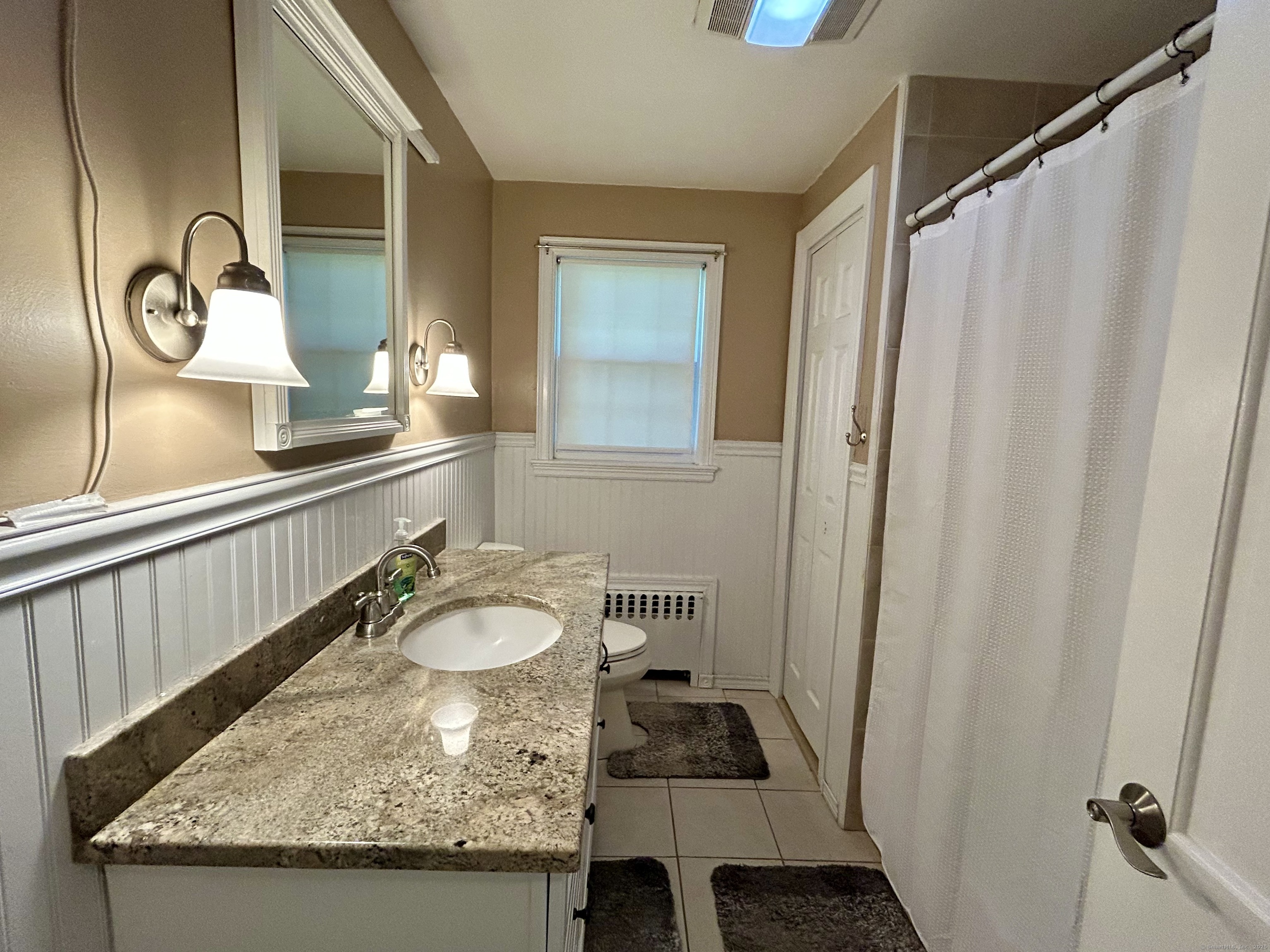 30 Apter Drive Torrington, CT 06790 - Photo 8 of 36 a bathroom with a granite countertop sink and a mirror