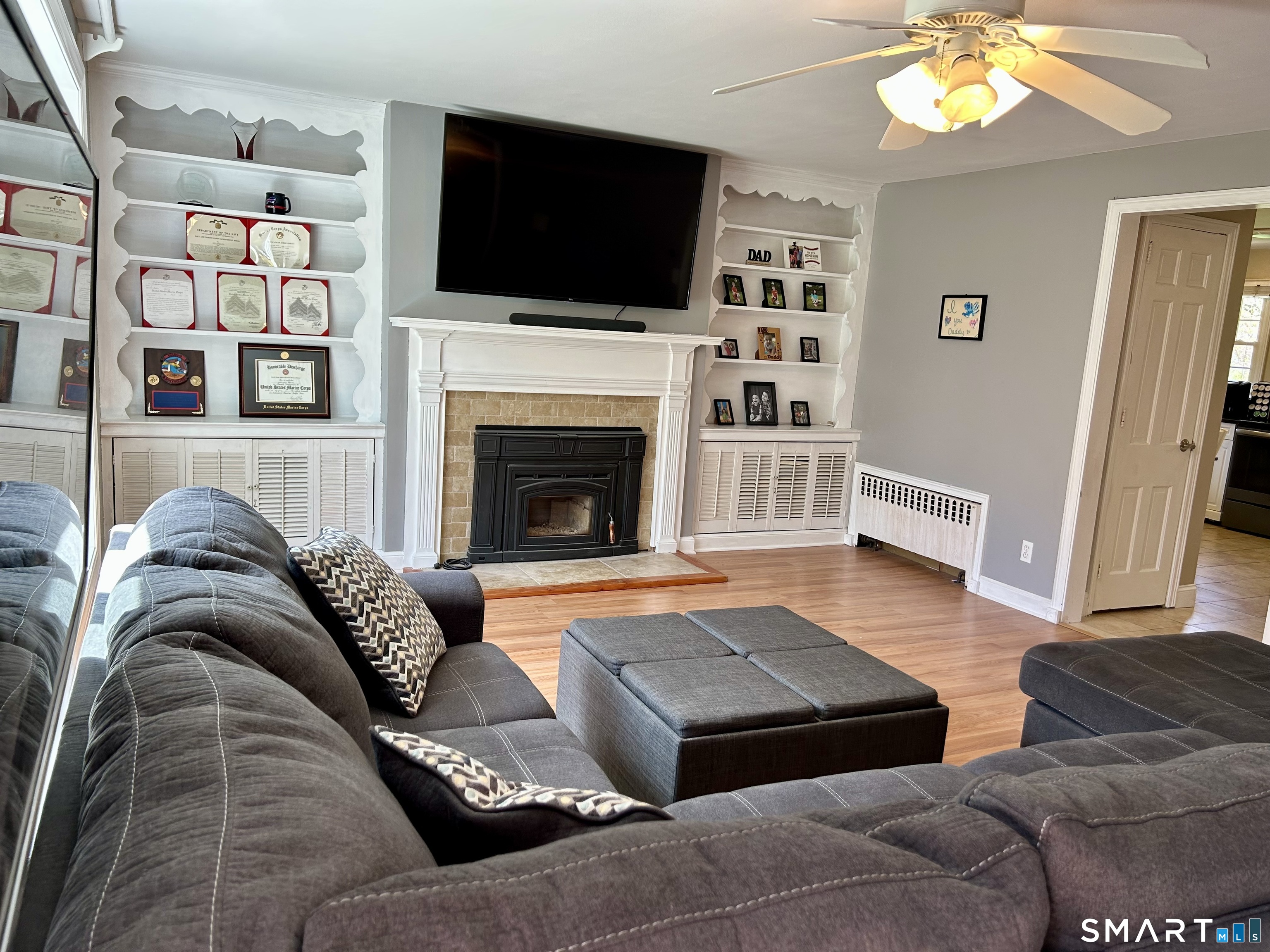 30 Apter Drive Torrington, CT 06790 - Photo 9 of 36 a living room with furniture fireplace and flat screen tv