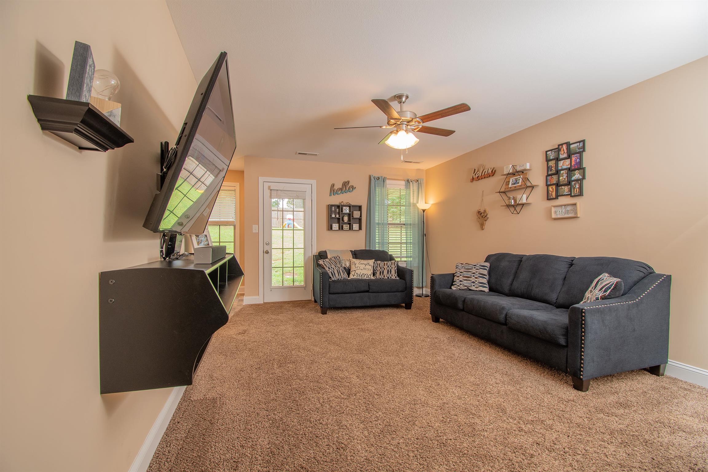 737 Inver Lane Clarksville, TN 37042 - Photo 9 of 17 a living room with furniture and a flat screen tv