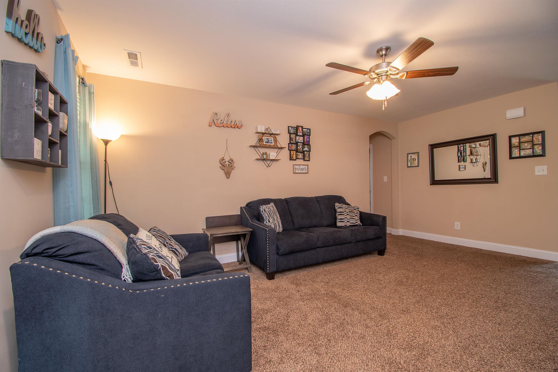 737 Inver Lane Clarksville, TN 37042 - Photo 10 of 17 a living room with couches and a ceiling fan