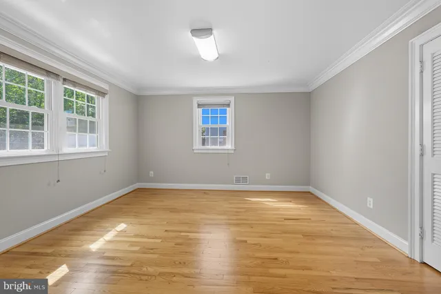 a bathroom with a sink toilet and a mirror