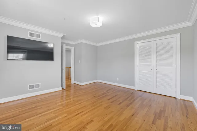 a view of wooden floor in an empty room