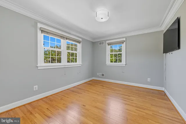 a view of a room with a flat screen tv and staircase