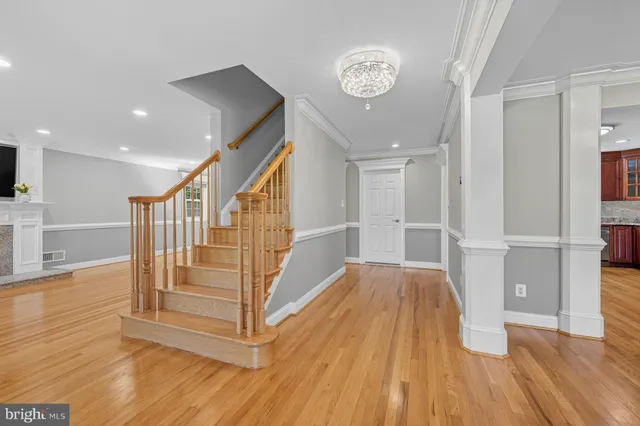 a view of entryway with wooden floor