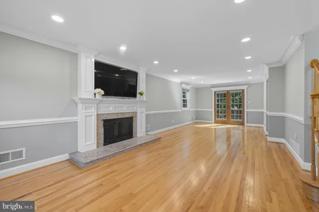 a view of a livingroom with an empty space and a fireplace