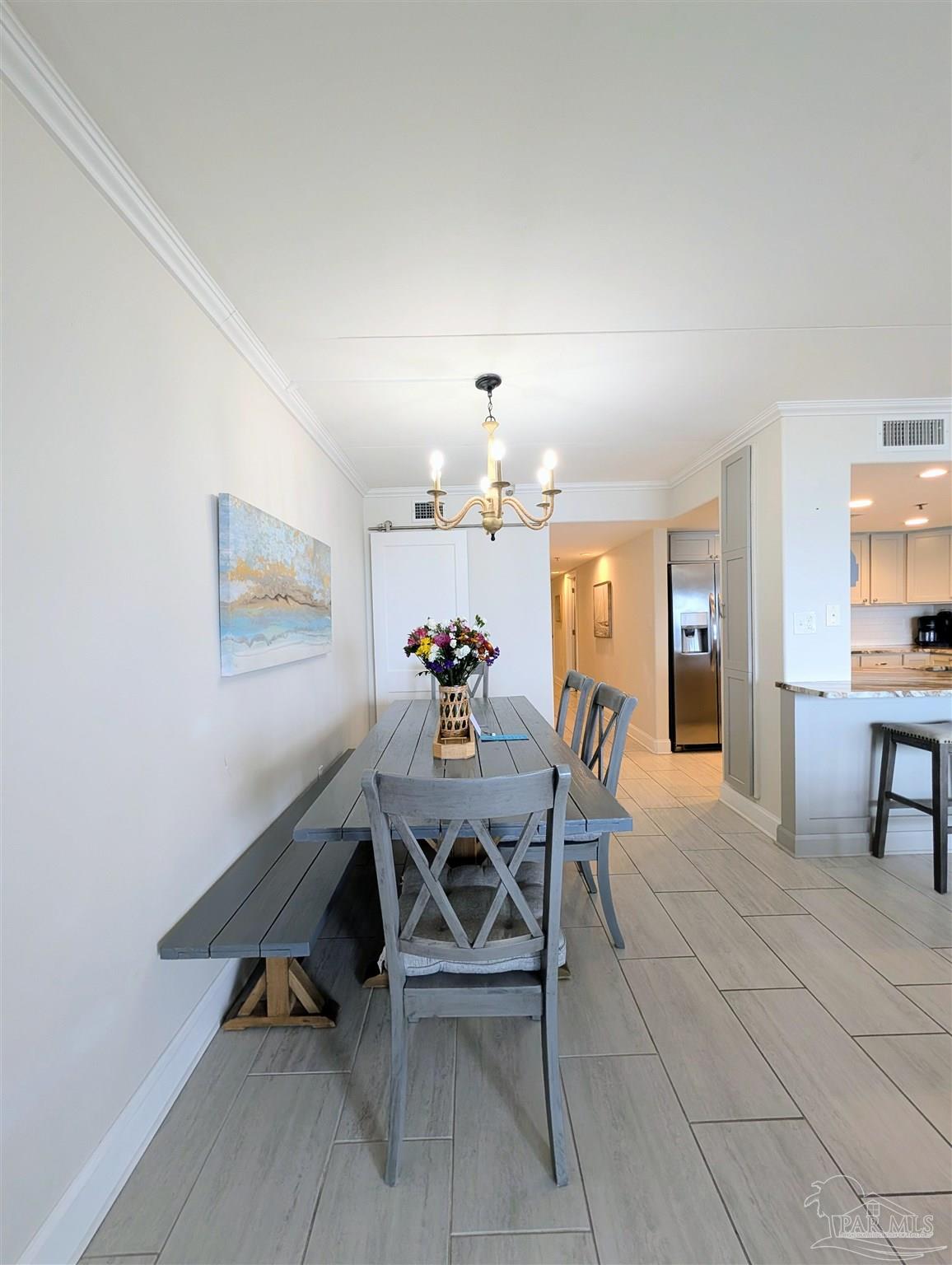 14623 Perdido Key Drive, Unit 401 Perdido Key, FL 32507 - Photo 16 of 40 a dining room with furniture and window