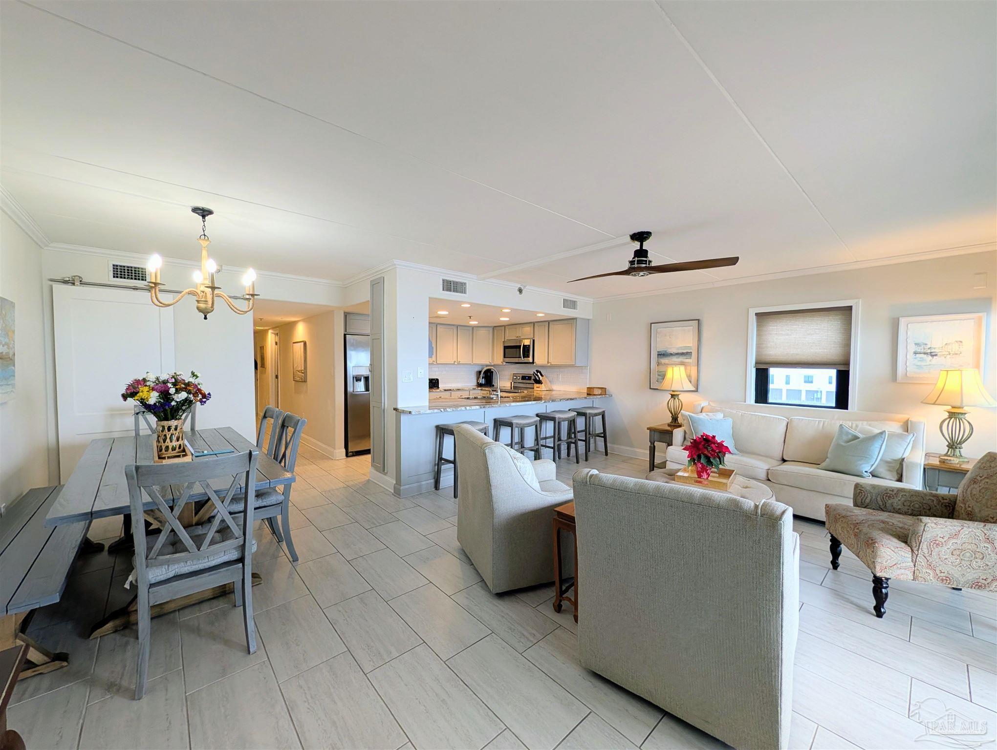 14623 Perdido Key Drive, Unit 401 Perdido Key, FL 32507 - Photo 17 of 40 a living room with furniture and a dining room
