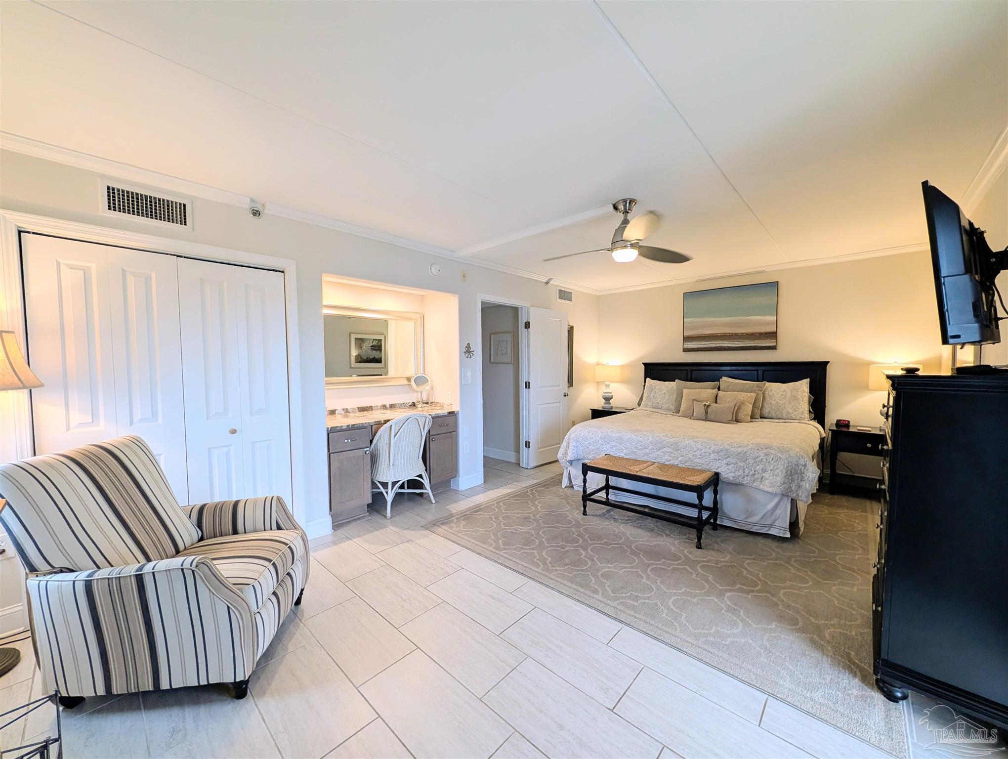 14623 Perdido Key Drive, Unit 401 Perdido Key, FL 32507 - Photo 18 of 40 a bedroom with a bed and couch