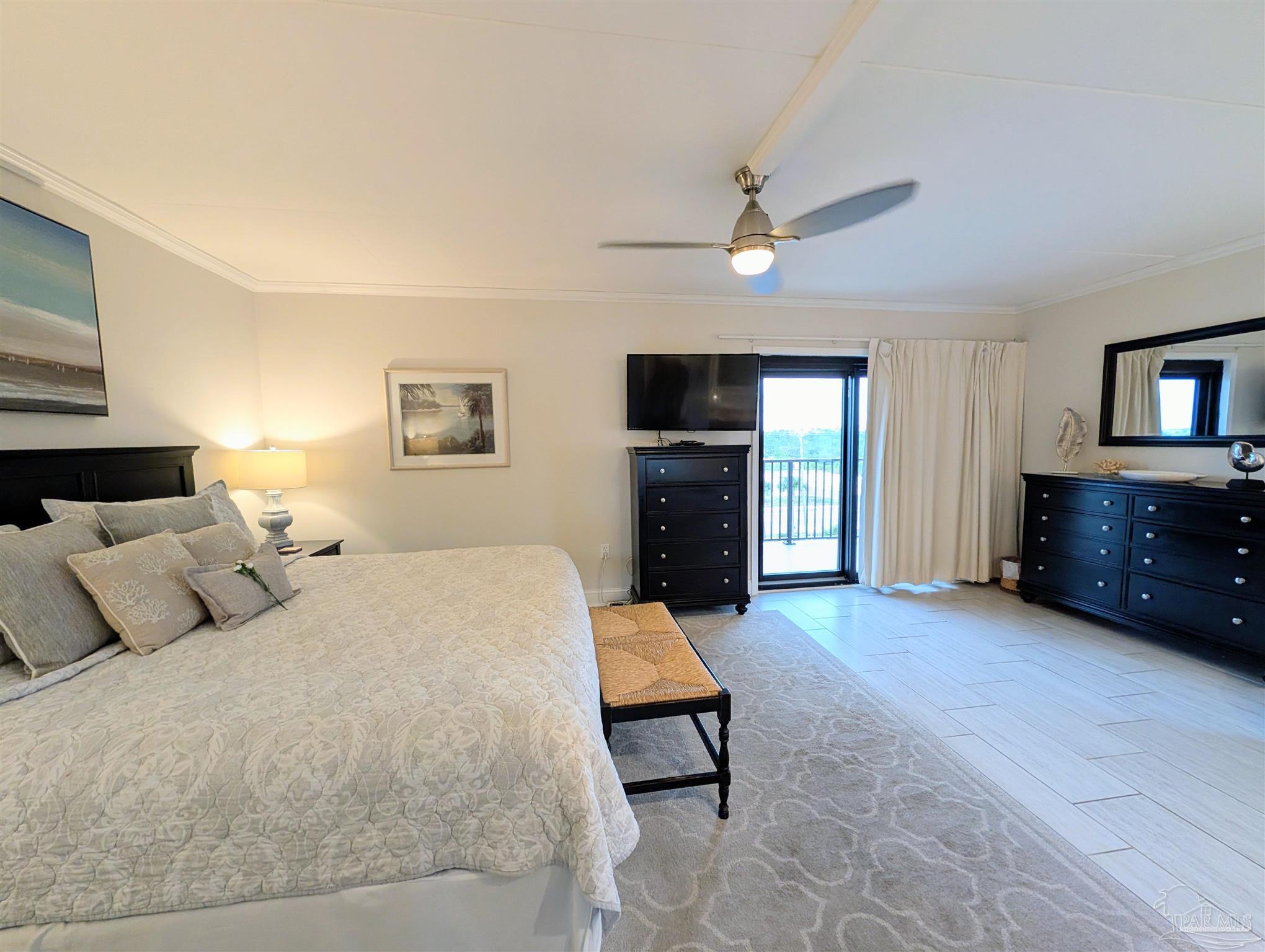 14623 Perdido Key Drive, Unit 401 Perdido Key, FL 32507 - Photo 20 of 40 a bed room with a bed and a television