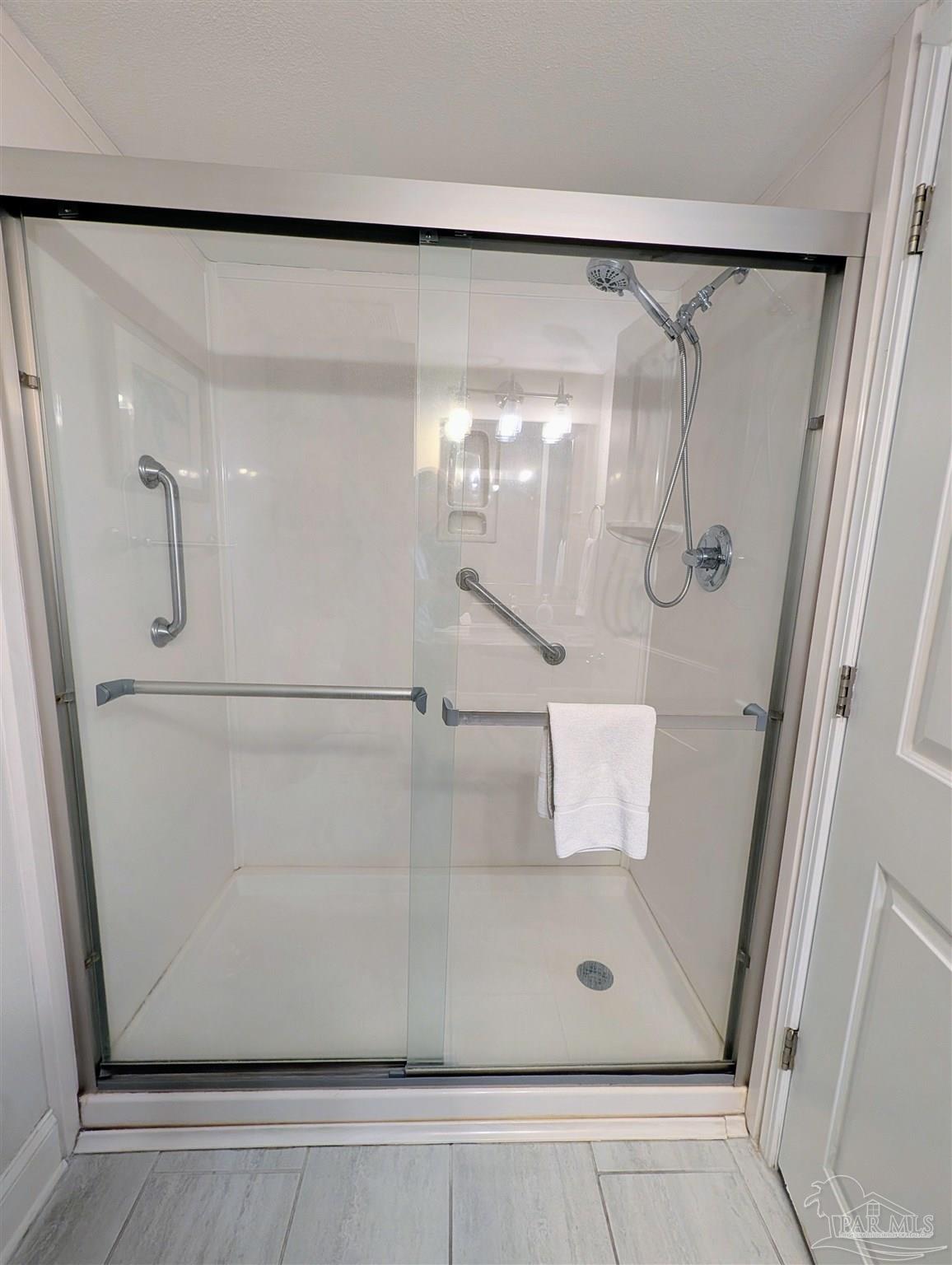 14623 Perdido Key Drive, Unit 401 Perdido Key, FL 32507 - Photo 24 of 40 a bathroom with a glass shower door