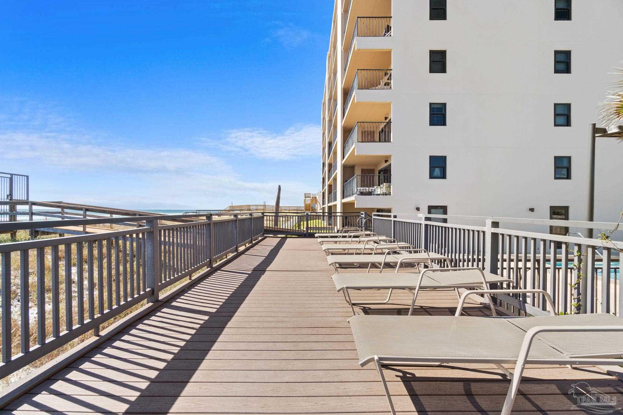 14623 Perdido Key Drive, Unit 401 Perdido Key, FL 32507 - Photo 34 of 40 a view of a balcony with wooden floor and seating space