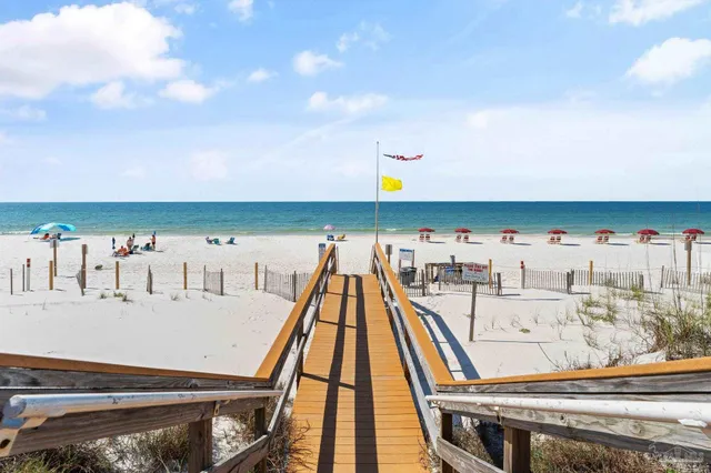 a view of a swimming pool and lounge chair