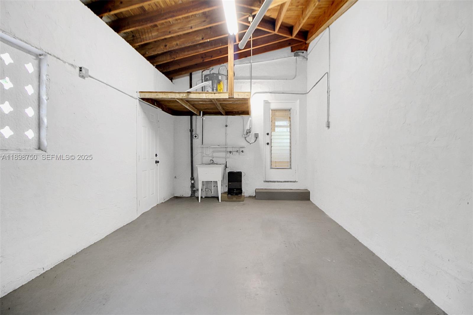 231 Northeast 43rd Street Miami, FL 33137 - Photo 21 of 35 a view of a room with wooden walls
