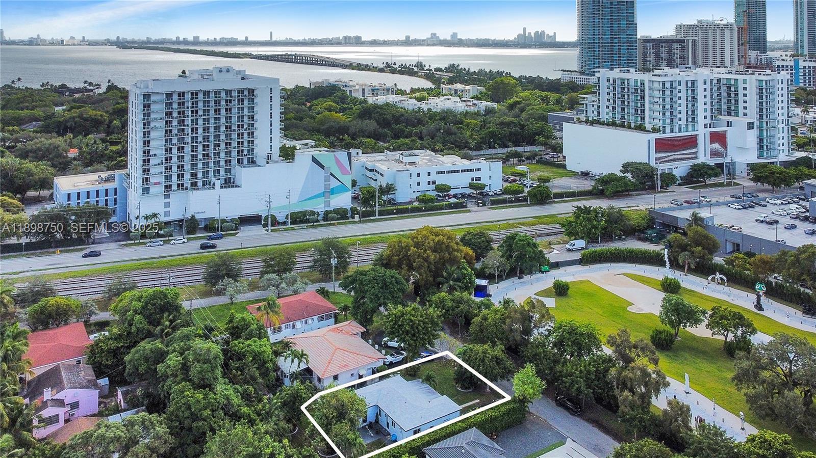 231 Northeast 43rd Street Miami, FL 33137 - Photo 3 of 35 an aerial view of a house with a swimming pool yard and outdoor seating