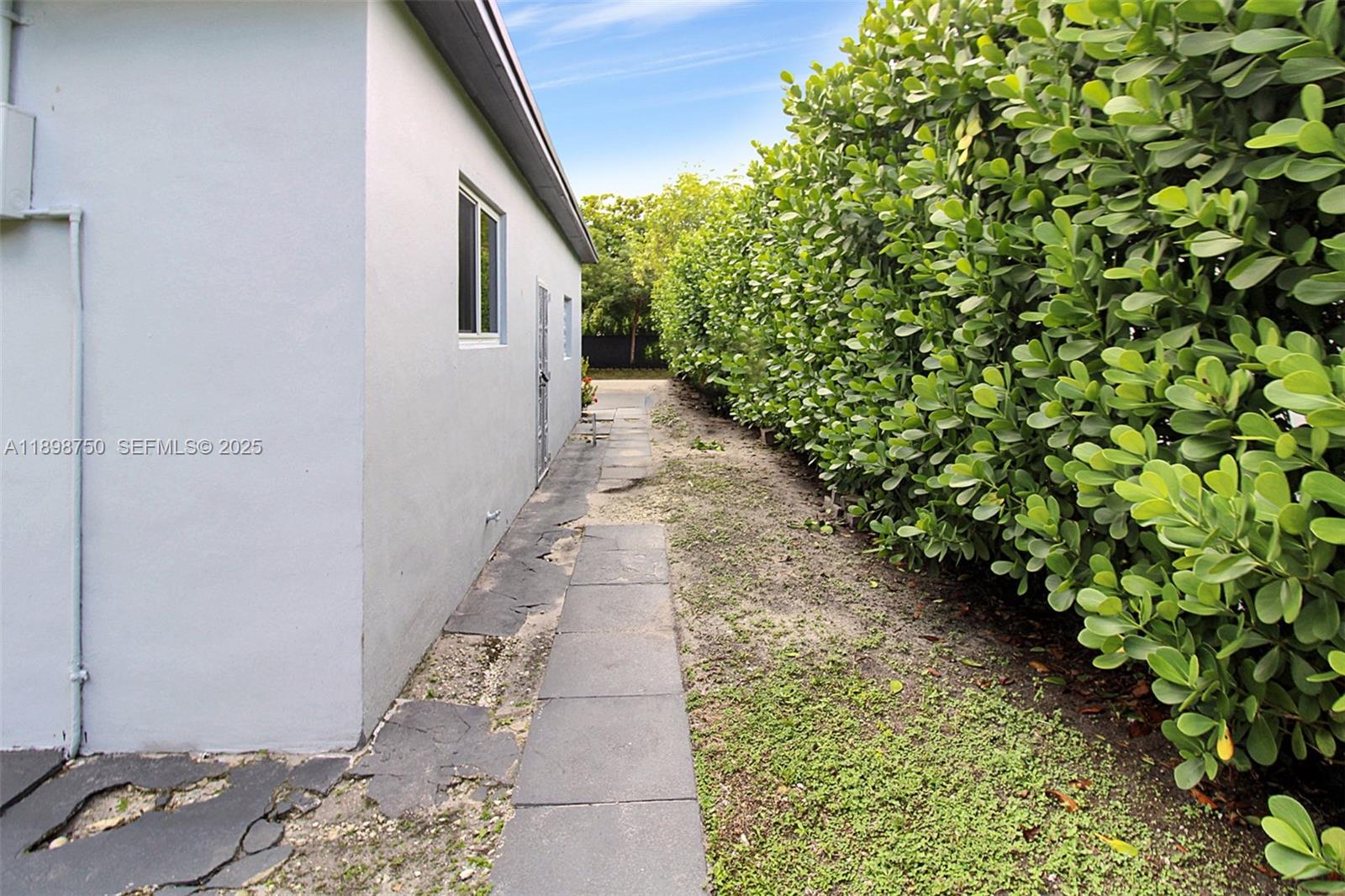 231 Northeast 43rd Street Miami, FL 33137 - Photo 31 of 35 a view of a pathway with a yard