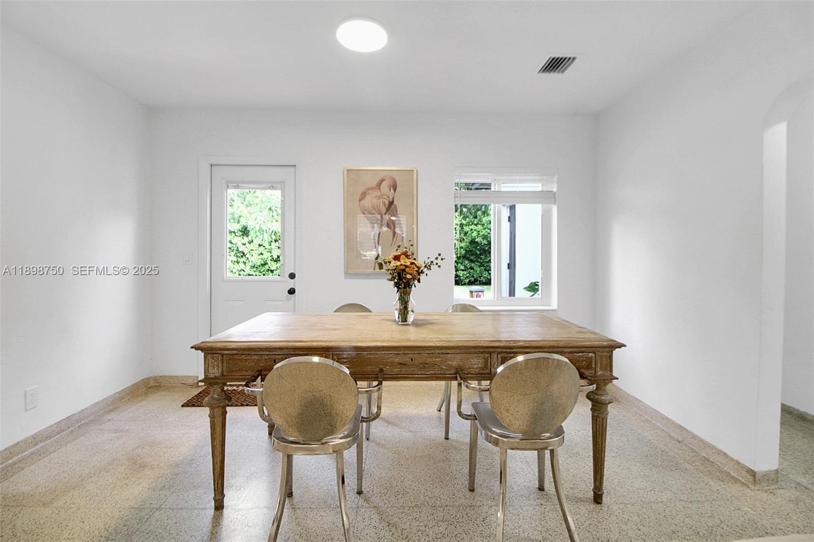 231 Northeast 43rd Street Miami, FL 33137 - Photo 7 of 35 a view of a dining room with furniture and window