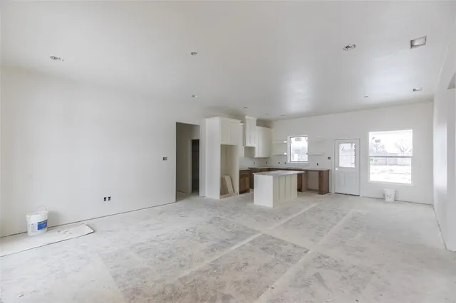 a kitchen with stainless steel appliances a sink stove and refrigerator