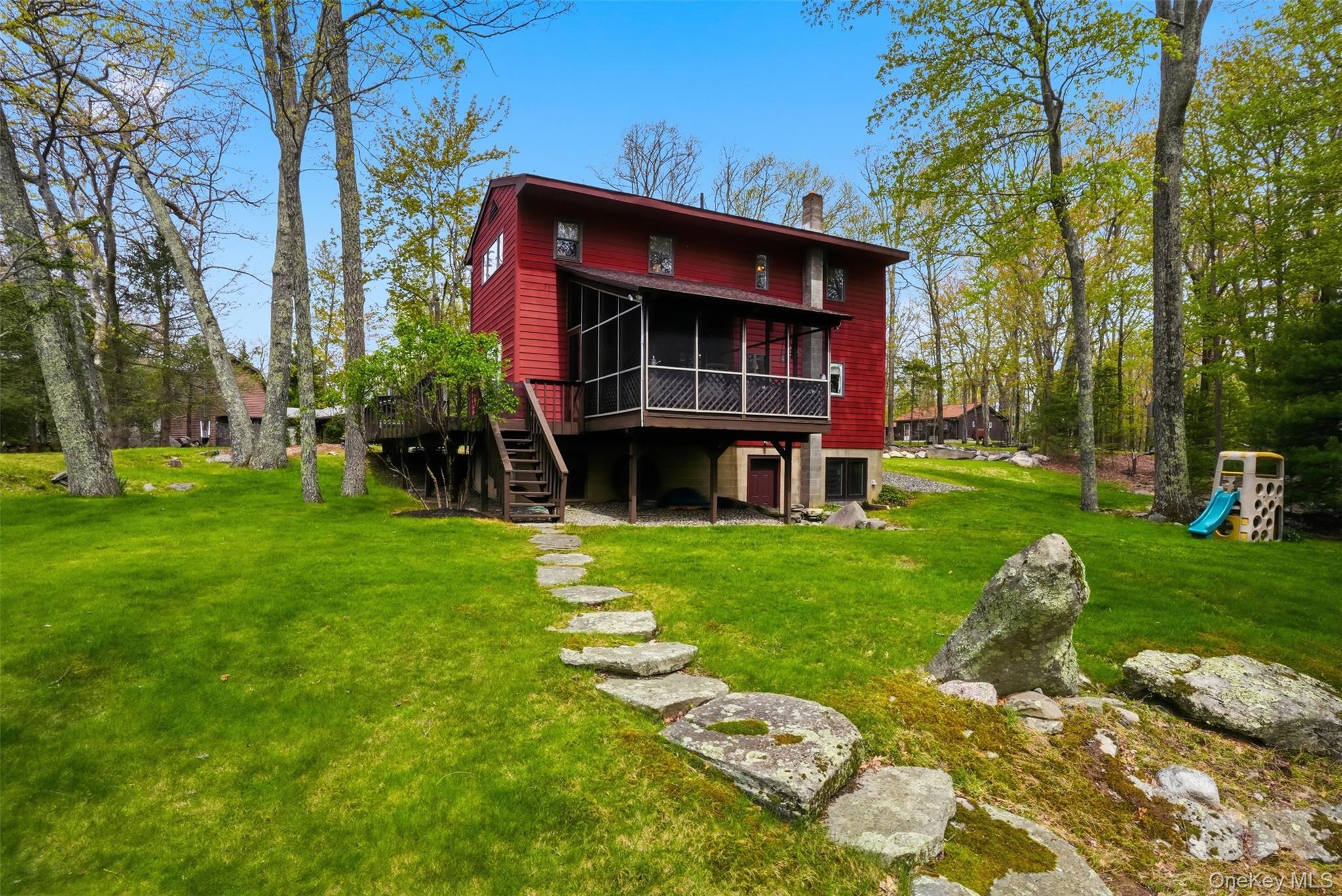 8 Division Road Wurtsboro, NY 12790 - Photo 11 of 50 View of expansive green lawn and screened in porch.