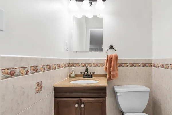 a bathroom with a sink a toilet and bathtub