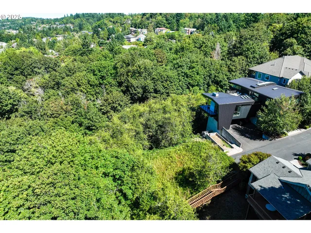 a view of a garden with a building
