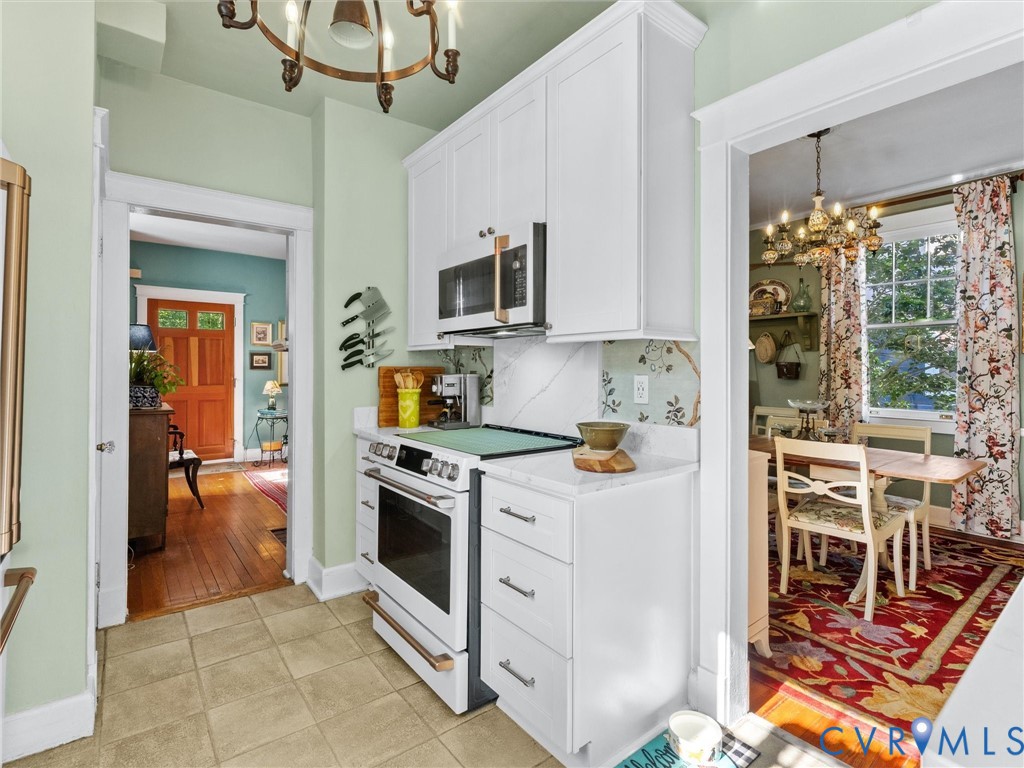 1812 Seddon Road Richmond, VA 23227 - Photo 23 of 56 Kitchen featuring white shaker-style cabinetry, a