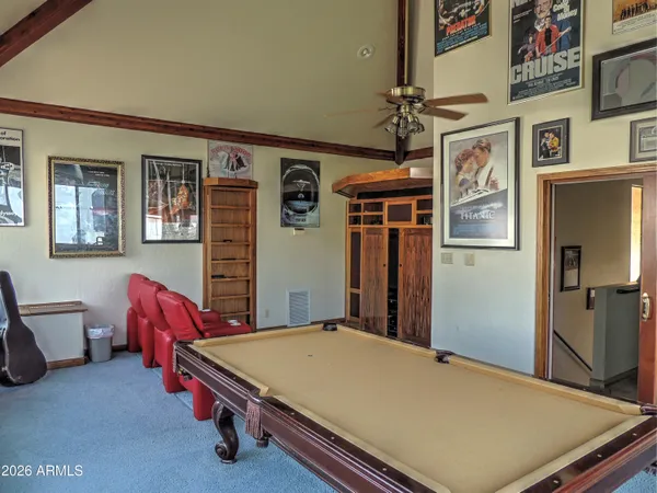 a room with gym equipment and a large window