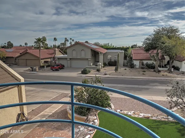 a workspace with wooden floor and furniture