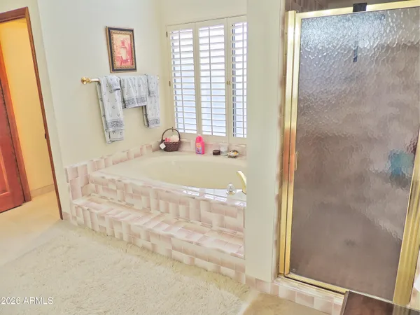 a view of a swimming pool with a patio and a yard