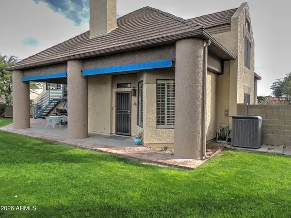 a view of a backyard of the house