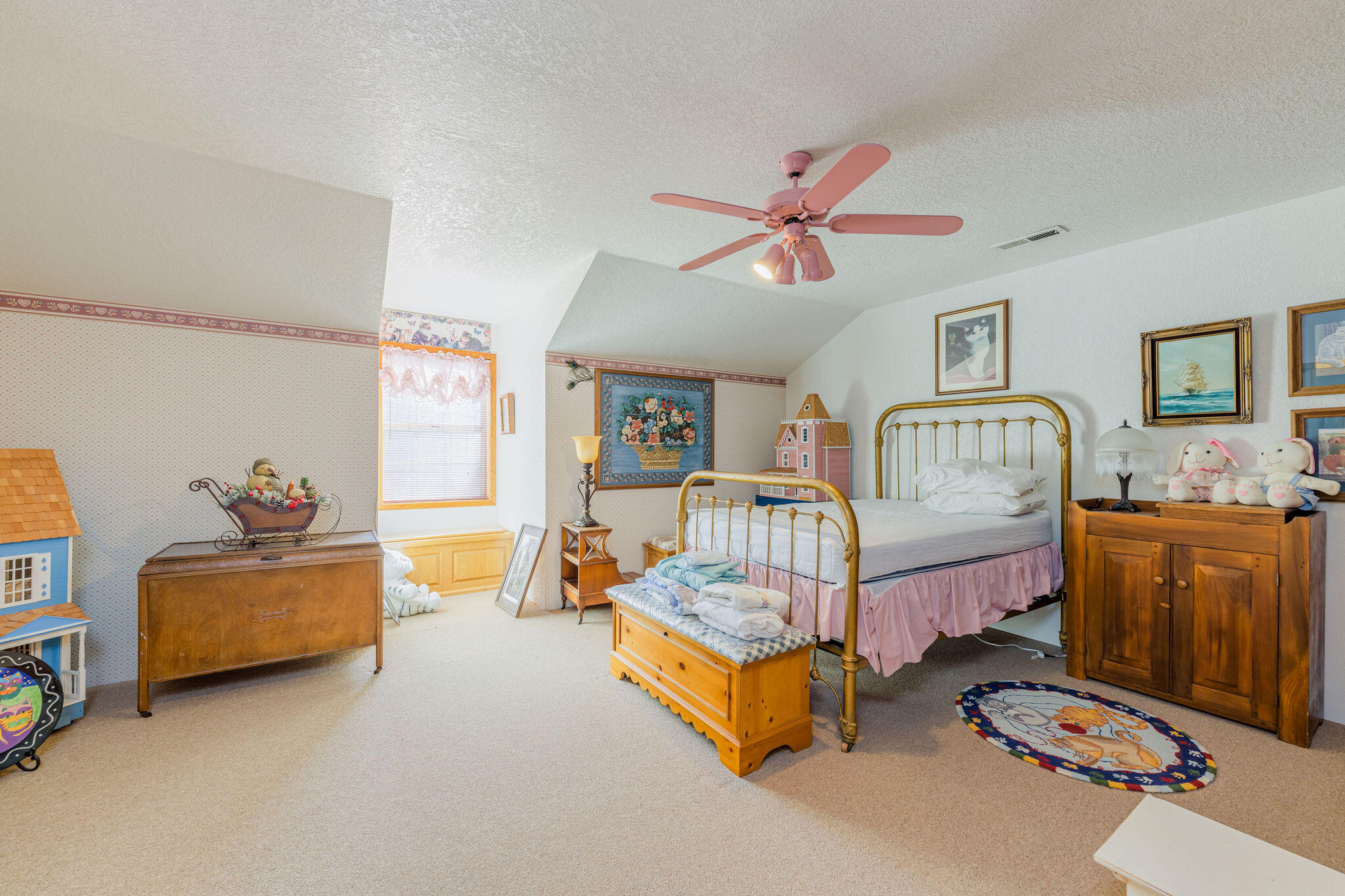6790 Holland Loop Road Cave Junction, OR 97523 - Photo 33 of 151 a bedroom with furniture and a window