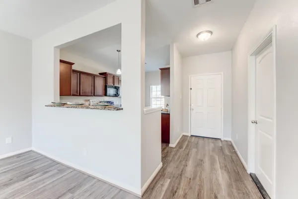 a view of a kitchen from the hallway