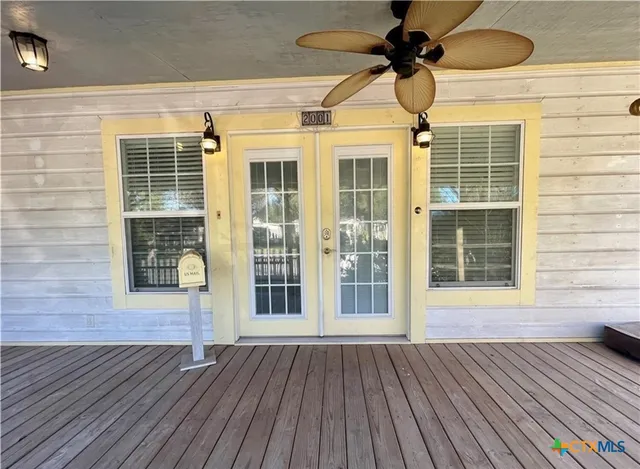 a view of a house with wooden floor and a window