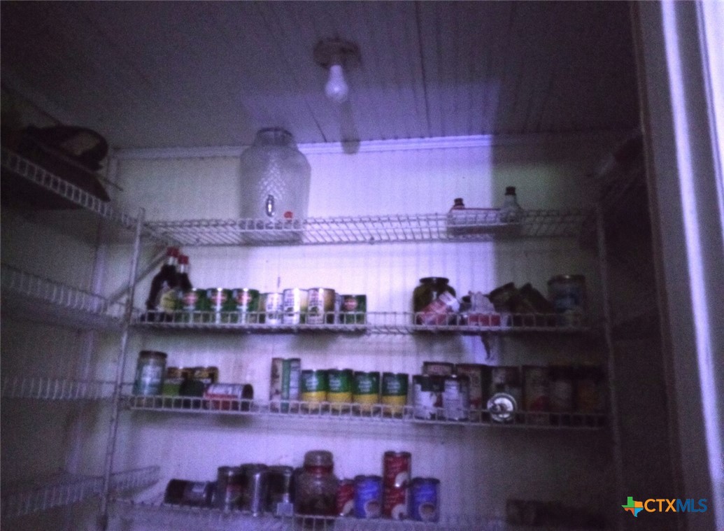 2001 East Forrest Street Victoria, TX 77901 - Photo 9 of 16 a kitchen with lots of bottles of alcohol