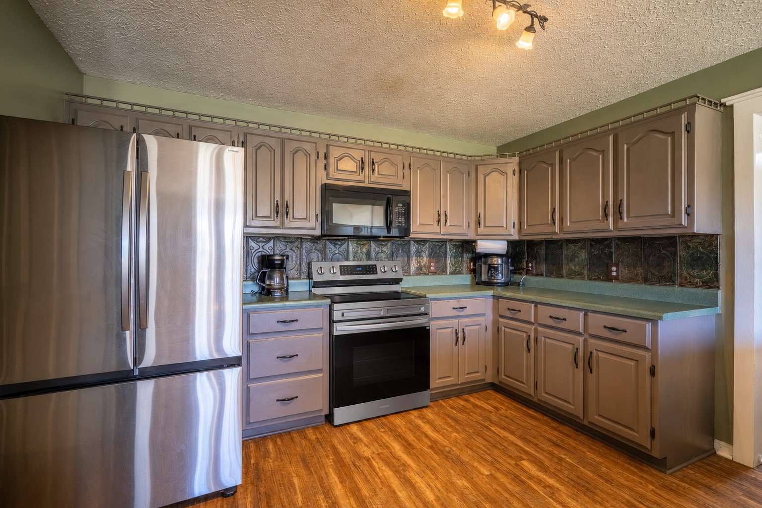 11220 Shelbyville Road Morrison, TN 37357 - Photo 11 of 67 a kitchen with stainless steel appliances granite countertop a refrigerator sink and cabinets