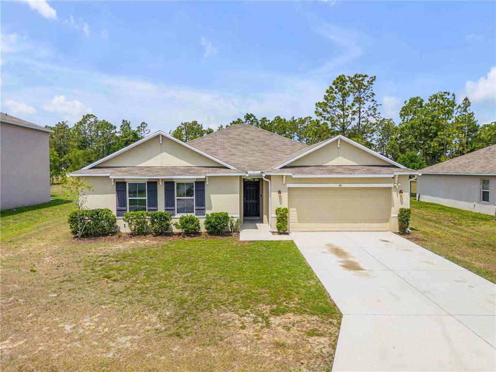 48 Hickory Loop Ocala, FL 34472 - Photo 51 of 52 a front view of a house with yard