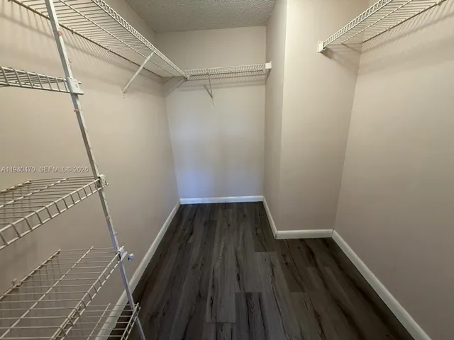 a view of gallery with wooden floor